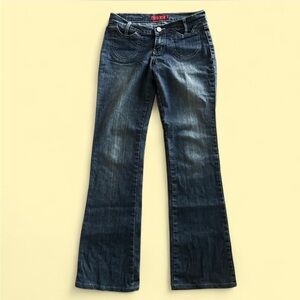 Dark wash low rise bootcut or maybe flare jeans